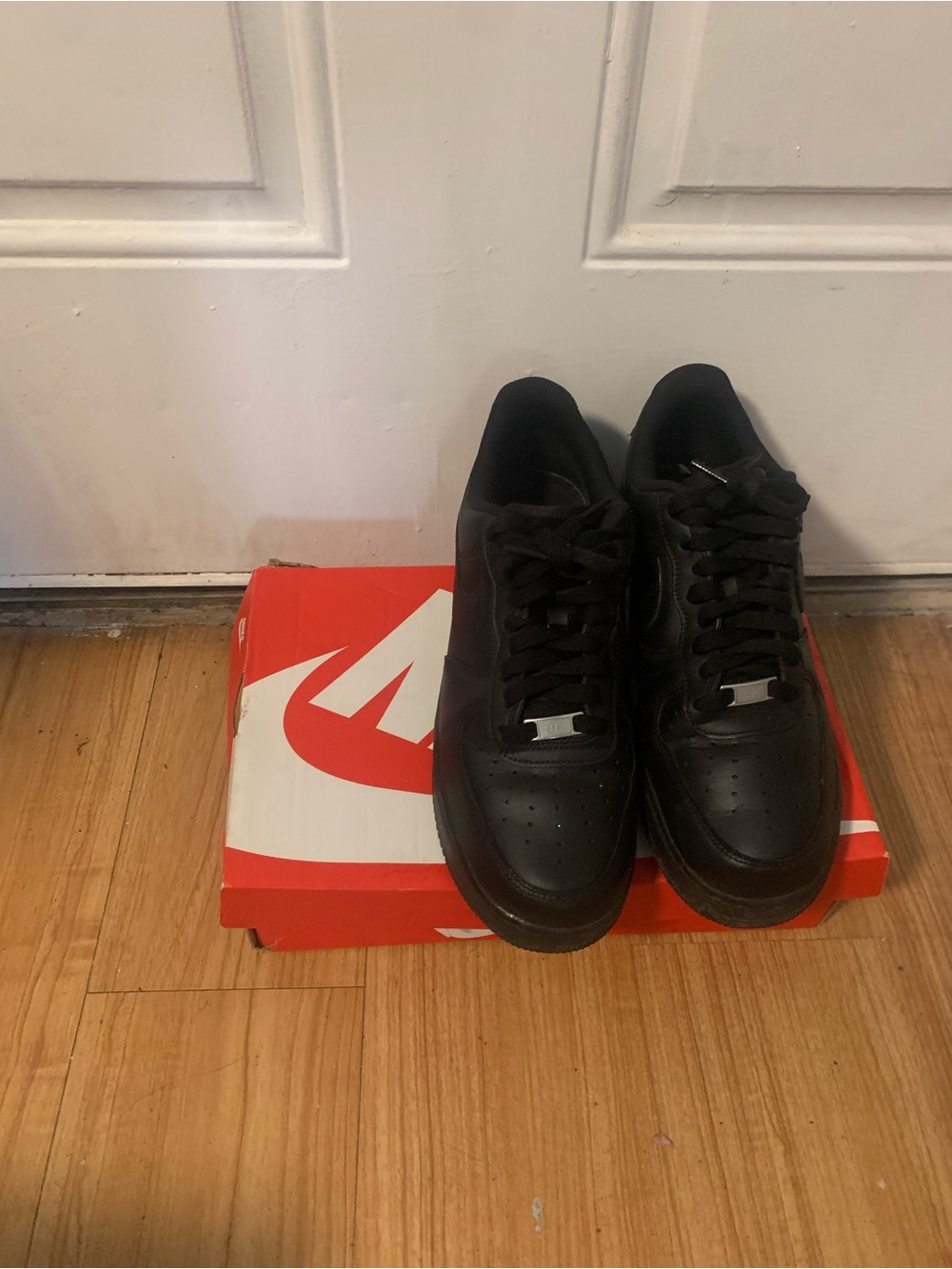 Nike Black Low-Top Sneakers with Lace-Up Design